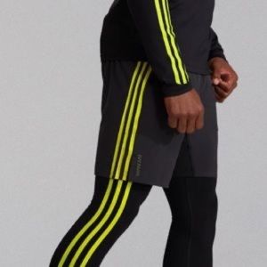 From the IVY PARK Peloton Colab comes the unisex black & yellow tights size M.